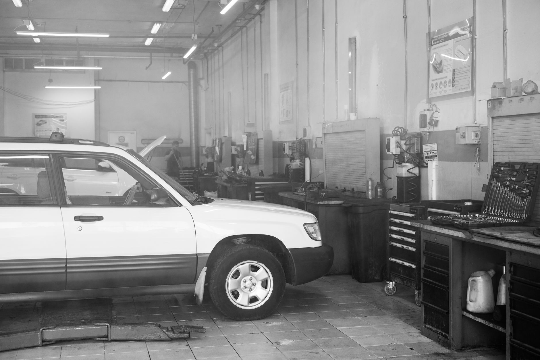 Auto repair shop interior, car ready for service